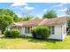 Inviting single-story residence with lush greenery and well-maintained exterior, perfect for comfortable living at 414 N Cypress St, Wendell, NC 27591