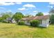 Traditional single-story home boasting a spacious front yard and mature trees, offering a serene setting at 414 N Cypress St, Wendell, NC 27591