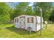 Outdoor shed with a unique design, offering ample storage space and practical utility for the property at 414 N Cypress St, Wendell, NC 27591