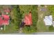 A unique bird's eye view of the house, its red roof and the surrounding land at 429 N Asheboro St, Liberty, NC 27298
