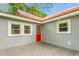 Outdoor backyard featuring a patio with a red door and light gray siding at 429 N Asheboro St, Liberty, NC 27298