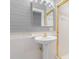 Charming bathroom with pedestal sink and gold trim at 429 N Asheboro St, Liberty, NC 27298