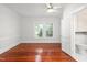 Bright bedroom with hardwood floors and an attached bathroom at 429 N Asheboro St, Liberty, NC 27298