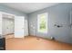 Laundry room features lots of light and painted wood paneling at 429 N Asheboro St, Liberty, NC 27298