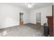 Bright living room featuring new carpet, fireplace, and a ceiling fan at 429 N Asheboro St, Liberty, NC 27298