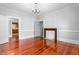 Bright living room featuring a fireplace and hardwood floors at 429 N Asheboro St, Liberty, NC 27298