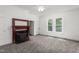 Bright living room with new carpet, fireplace, and windows at 429 N Asheboro St, Liberty, NC 27298