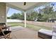 Relaxing back patio with a comfortable seating area and lush green backyard is perfect for outdoor living at 4405 Aubaun Way, Knightdale, NC 27545