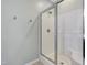 Bathroom highlighting a glass enclosed shower with built-in seating and chrome fixtures at 4405 Aubaun Way, Knightdale, NC 27545