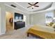 Large main bedroom with a walk-in closet and a tray ceiling with a ceiling fan at 4405 Aubaun Way, Knightdale, NC 27545