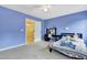 Blue bedroom with ceiling fan and desk at 4405 Aubaun Way, Knightdale, NC 27545