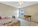Bedroom with ceiling fan, desk, and natural light from window at 4405 Aubaun Way, Knightdale, NC 27545