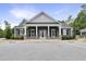 Charming clubhouse featuring stylish architectural details, stone accents, and well-manicured landscaping at 4405 Aubaun Way, Knightdale, NC 27545