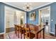 Beautiful dining space featuring a large table set for gatherings, with adjacent rooms visible at 4405 Aubaun Way, Knightdale, NC 27545