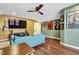 Relaxing living room featuring a large TV, comfortable seating, and movie posters to create a home theatre experience at 4405 Aubaun Way, Knightdale, NC 27545
