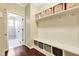 Bright mudroom with built-in storage cubbies, bench seating, and hooks for organization, ensuring a clutter-free home at 4405 Aubaun Way, Knightdale, NC 27545