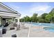 Inviting poolside lounge area with comfortable seating, offering a relaxing space by the community pool at 4405 Aubaun Way, Knightdale, NC 27545