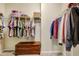 Spacious walk-in closet featuring ample shelving and wood storage chest at 4405 Aubaun Way, Knightdale, NC 27545