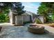 Private backyard features a fire pit, patio area, and lush landscaping at 4900 Old Millcrest Ct, Raleigh, NC 27609