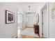Welcoming foyer with hardwood floors, a decorative chandelier, and an area rug, radiating warmth at 4900 Old Millcrest Ct, Raleigh, NC 27609