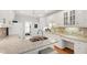 This charming kitchen boasts granite countertops, hardwood floors, and white cabinets with abundant storage space at 4900 Old Millcrest Ct, Raleigh, NC 27609