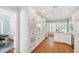 Bright kitchen features hardwood floors, granite countertops, white cabinets, and stainless steel appliances at 4900 Old Millcrest Ct, Raleigh, NC 27609