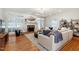 Bright living room with hardwood floors, fireplace, and modern furniture at 4900 Old Millcrest Ct, Raleigh, NC 27609