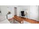 Bright office space with hardwood floors, featuring a desk and access to other rooms at 4900 Old Millcrest Ct, Raleigh, NC 27609
