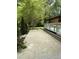Concrete patio and a wooden deck with forest views at 5601 Plum Nearly Ct, Raleigh, NC 27610