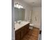 Bathroom features wood cabinets and a shower/tub combo at 5601 Plum Nearly Ct, Raleigh, NC 27610