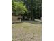 Cabin with a wooden deck and stone landscaping along with a gravel yard at 5601 Plum Nearly Ct, Raleigh, NC 27610