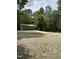 Spacious outbuilding with multiple garage doors providing ample storage and parking space at 5601 Plum Nearly Ct, Raleigh, NC 27610