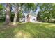 Expansive backyard offering mature shade trees at 5802 Newhall Rd, Durham, NC 27713