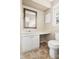 Well-lit bathroom featuring a white vanity with ample counter space and tile flooring at 5802 Newhall Rd, Durham, NC 27713
