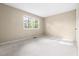 Bright bedroom with large windows providing lots of natural light at 5802 Newhall Rd, Durham, NC 27713
