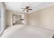Bright living room featuring a ceiling fan and open access to the kitchen at 5802 Newhall Rd, Durham, NC 27713