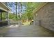 Beautiful backyard view with a wooden deck and access to the tree-lined yard at 6000 Canadero Dr, Raleigh, NC 27612