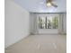 Well-lit bedroom with a large window and light-colored carpet at 6000 Canadero Dr, Raleigh, NC 27612