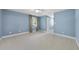 Serene bedroom features soft blue walls, neutral carpet, and natural light, creating a tranquil retreat at 6000 Canadero Dr, Raleigh, NC 27612