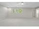 Airy bonus room with triple windows and ceiling fan, providing a well-lit and comfortable versatile space at 6000 Canadero Dr, Raleigh, NC 27612