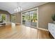 Large sliding glass doors flood this open-concept living space with natural light at 6000 Canadero Dr, Raleigh, NC 27612