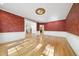 Dining room showcases hardwood floors, decorative wallpaper, and detailed ceilings at 6000 Canadero Dr, Raleigh, NC 27612