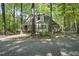 Charming one-story home surrounded by lush trees and a natural landscape at 6000 Canadero Dr, Raleigh, NC 27612