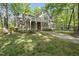 Beautiful home with brick and siding exterior, a covered porch, and a meticulously maintained front yard at 6000 Canadero Dr, Raleigh, NC 27612