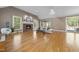 Spacious living room with fireplace, vaulted ceilings, and access to the deck at 6000 Canadero Dr, Raleigh, NC 27612