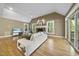 Bright living room featuring hardwood floors, fireplace, and vaulted ceilings at 6000 Canadero Dr, Raleigh, NC 27612