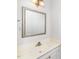 Bathroom featuring white cabinets, a silver framed mirror and ample counter space at 6000 Tenter Banks Sq, Raleigh, NC 27609