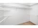 Walk-in closet with multiple rows of metal and wooden bars for hanging clothes at 6000 Tenter Banks Sq, Raleigh, NC 27609