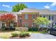 Charming brick home exterior featuring manicured landscaping, a neatly paved driveway, and mature trees at 6000 Tenter Banks Sq, Raleigh, NC 27609