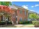 Traditional red brick home with well-maintained landscaping, charming entrance, and beautiful curb appeal at 6000 Tenter Banks Sq, Raleigh, NC 27609
